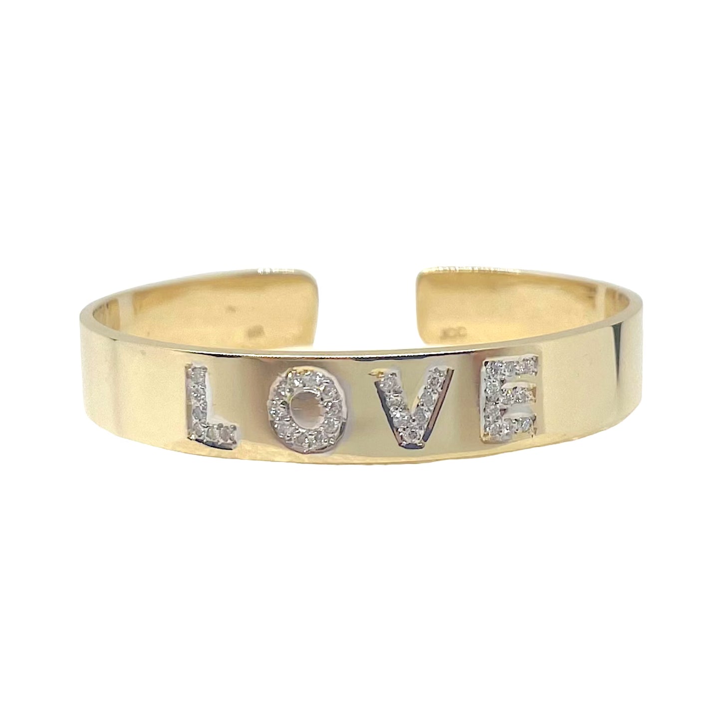 A 14K rose gold cuff bracelet with pave diamond letters spelling 'LOVE'.