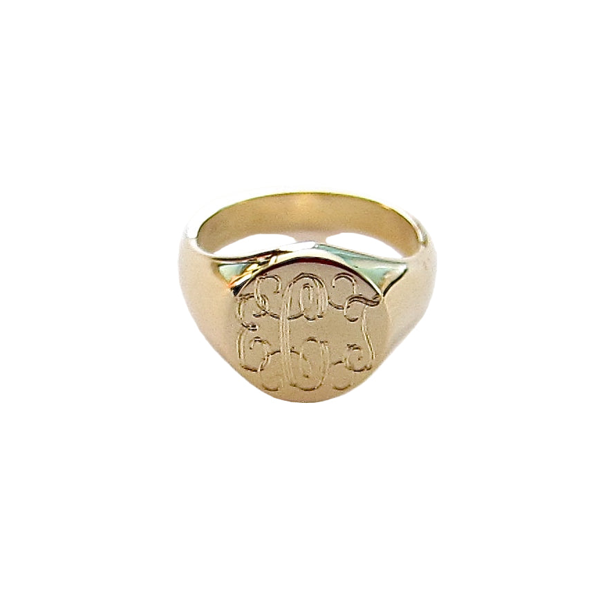 A 14k yellow gold ring with a classic monogram design on a white background.