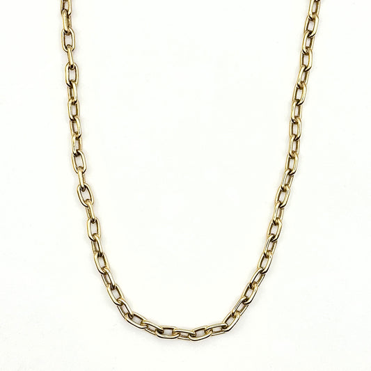 Gold chain necklace on a white background