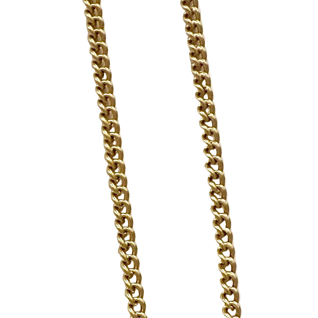 Gold chain necklace on a white background