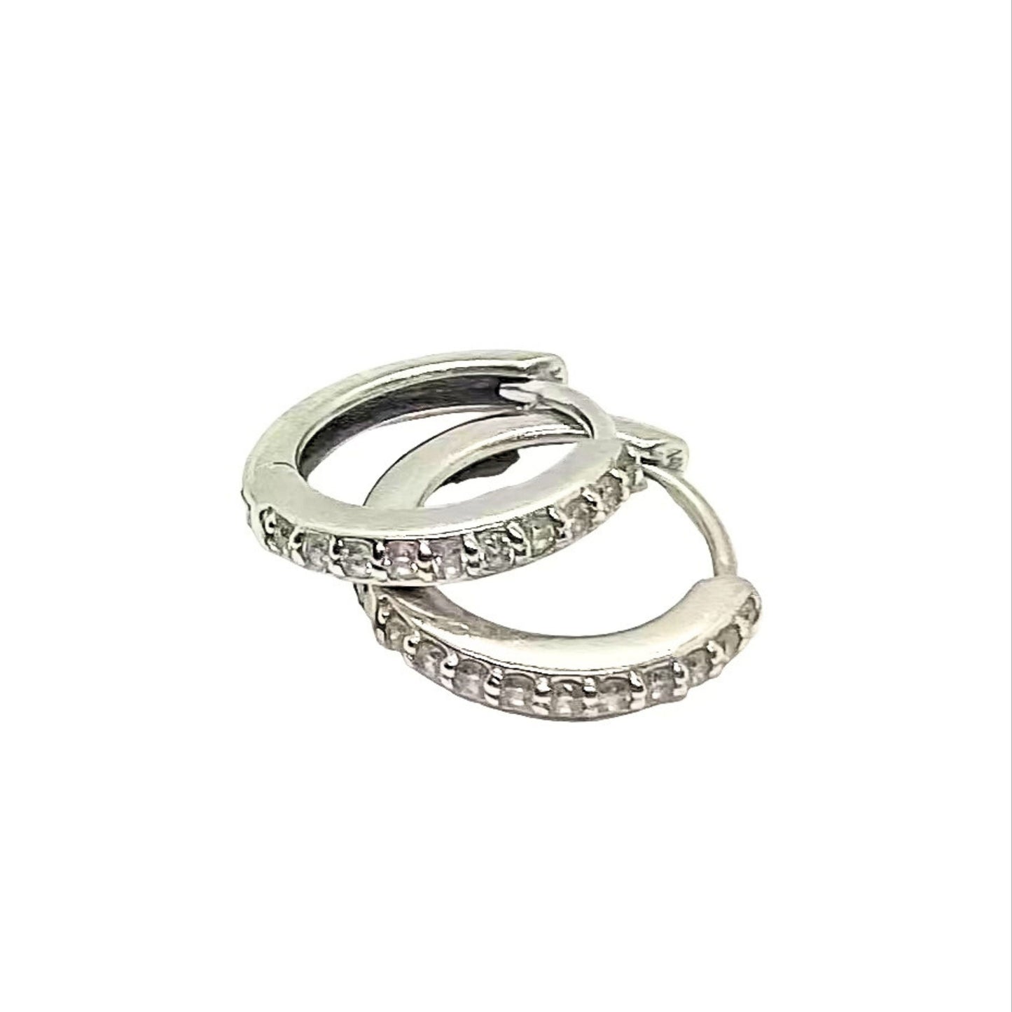 Pair of silver hoop earrings with small stones on a white background