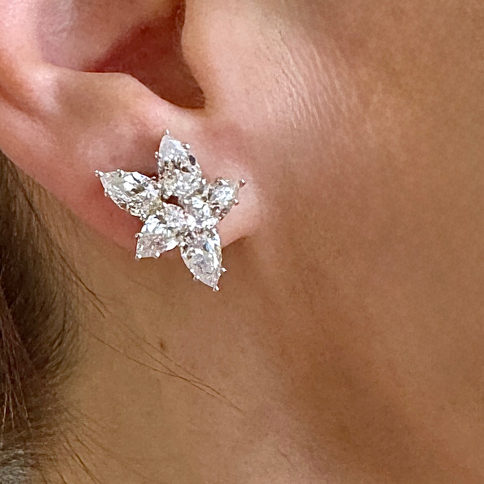 Close-up of a diamond earring on an ear