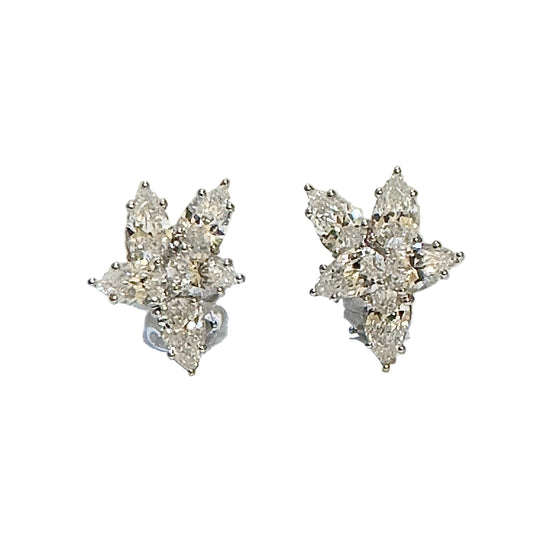 Pair of diamond earrings on a white background