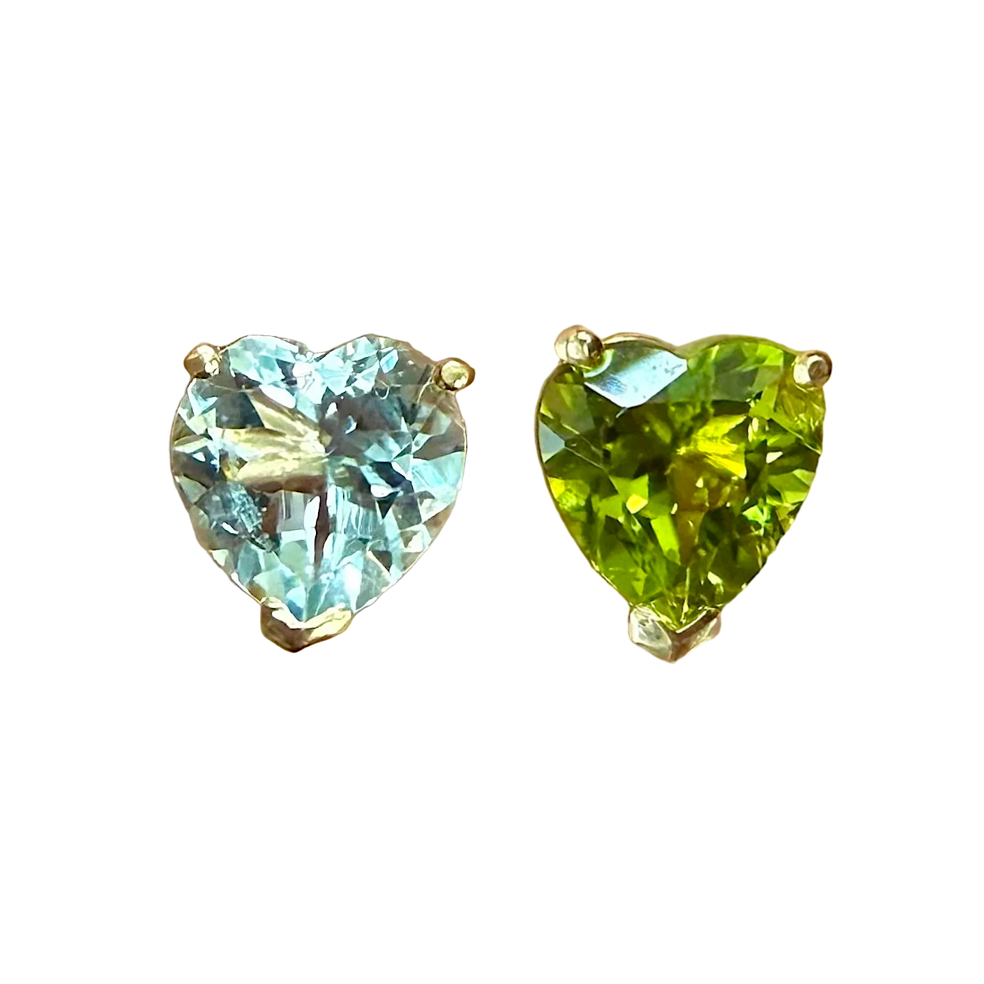 Heart-shaped gemstones in blue and green on a white background
