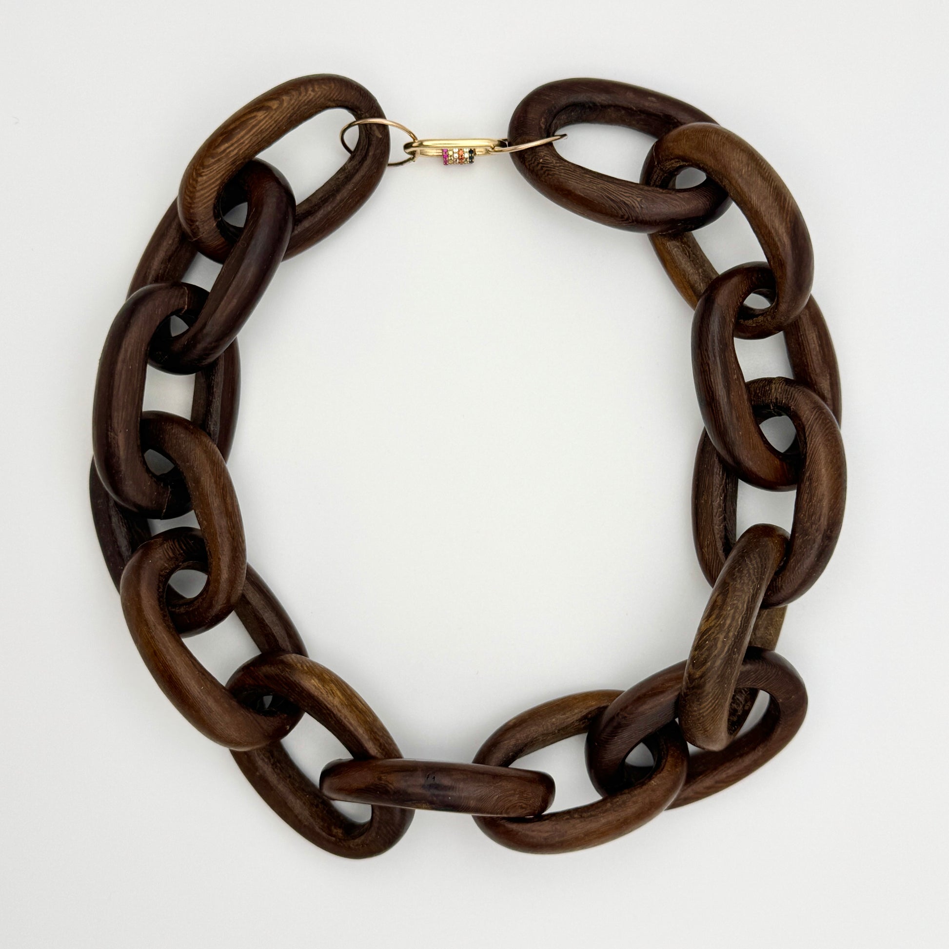 Brown wood chain necklace on a white background