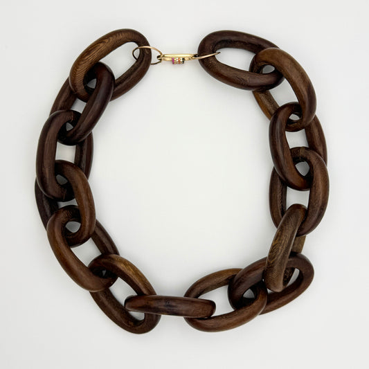 Brown wood chain necklace on a white background