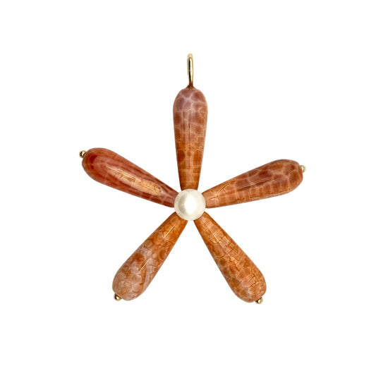 Pendant with five brown feather-like elements and a central pearl on a white background