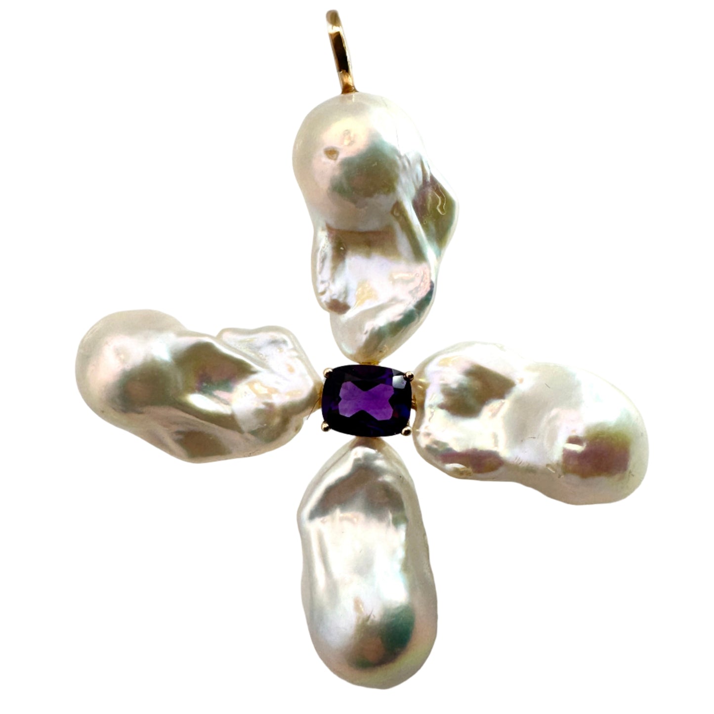 Pearl cross pendant with a central purple gemstone on a white background