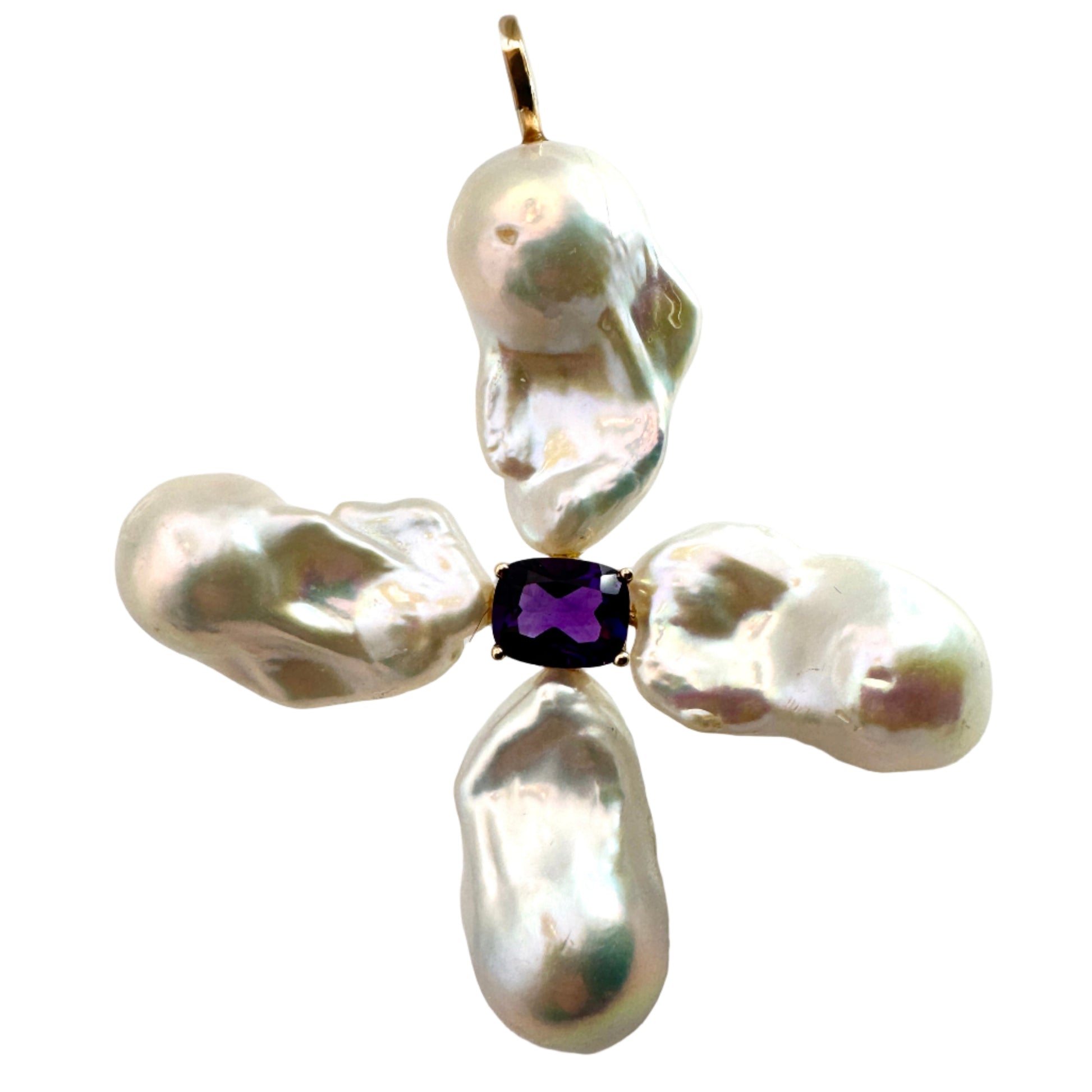 Pearl cross pendant with a central purple gemstone on a white background