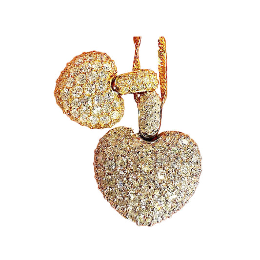 Gold heart-shaped earrings with diamonds on a white background