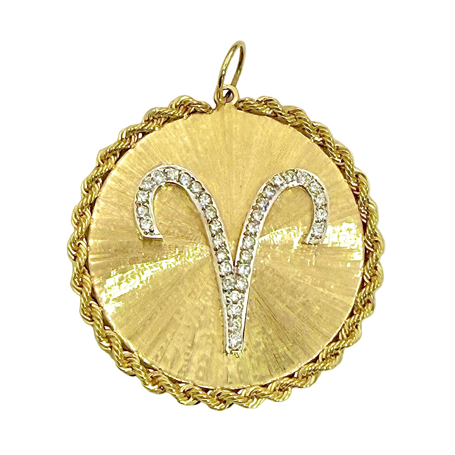 Gold pendant with Aries zodiac symbol on a white background 