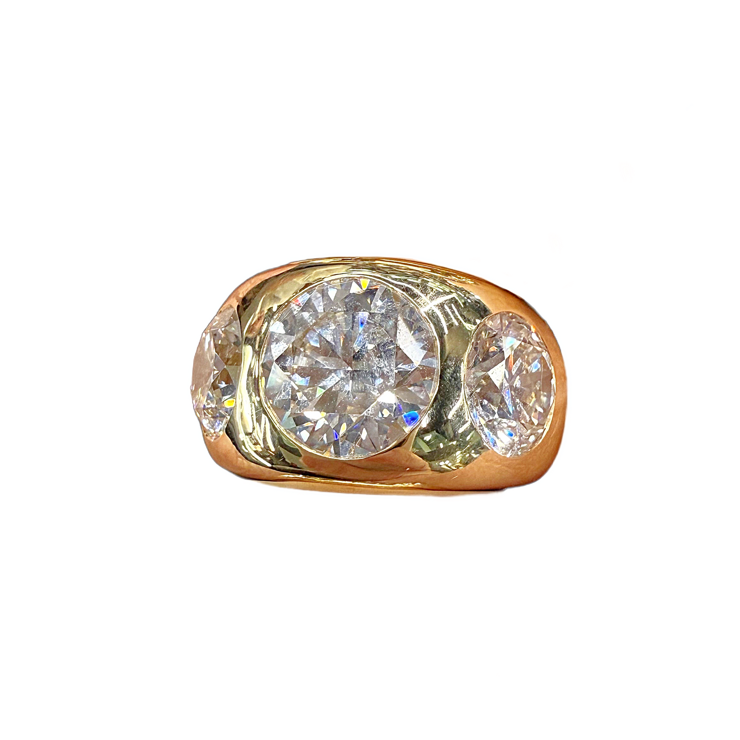 Gold ring with two large diamonds on a white background