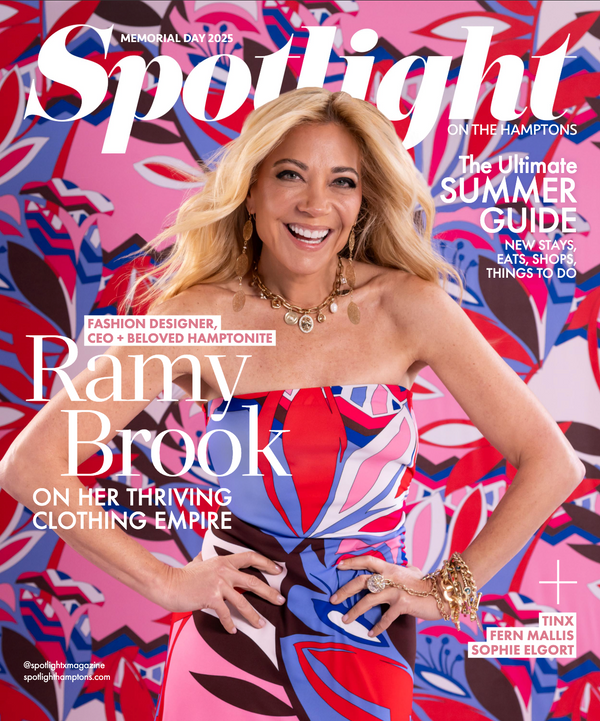 Spotlight magazine cover featuring Ramy Brook smiling in a bright, patterned strapless dress with bold red, blue, pink, and white abstract shapes. Large white 'Spotlight' masthead is at the top, with cover text including 'Ramy Brook' and 'On Her Thriving Clothing Empire'.