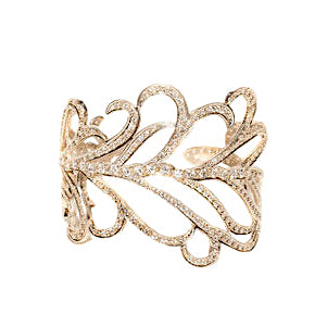 A 14k white gold cuff bracelet with pave diamonds, featuring a detailed feather pattern.