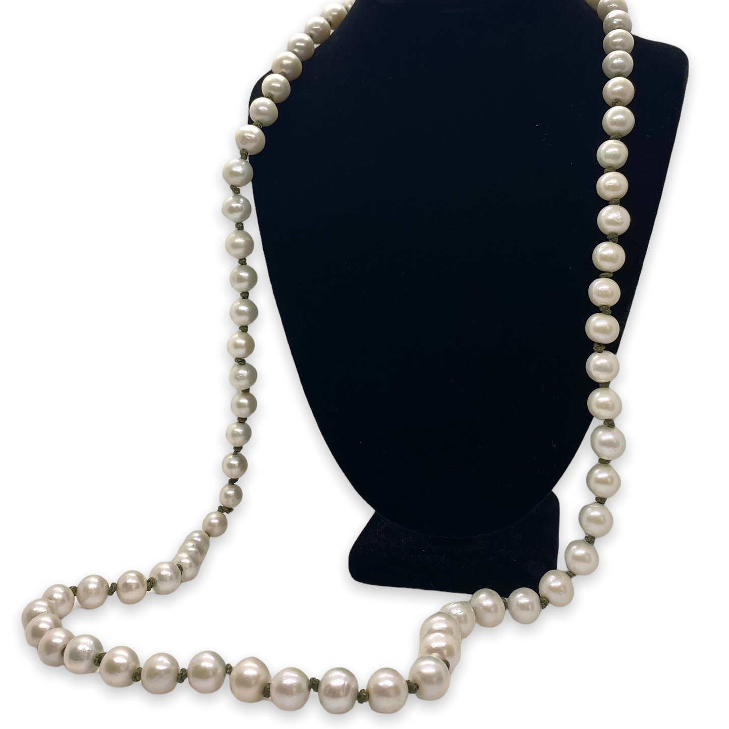 A black mannequin necklace displaying a string of large freshwater pearls with olive green knots.