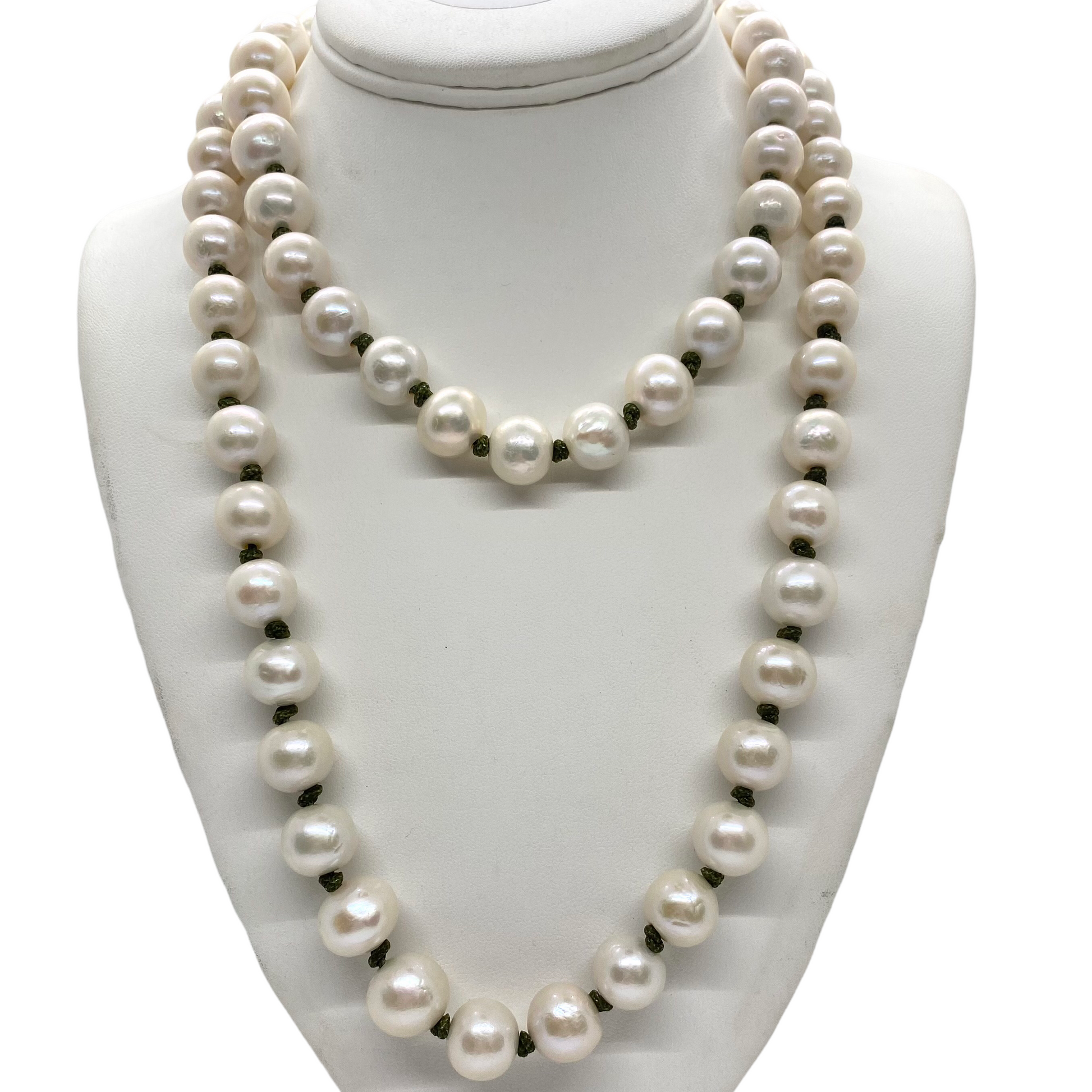Pearl necklace on a white mannequin bust
