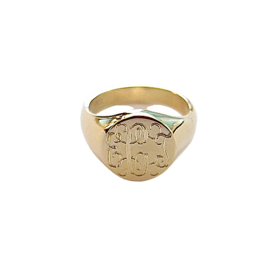 A 14k yellow gold ring with a classic monogram design on a white background.